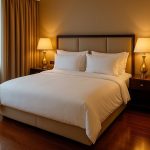 Hotel-Inspired Guest Space With White Bedding And Golden Touch